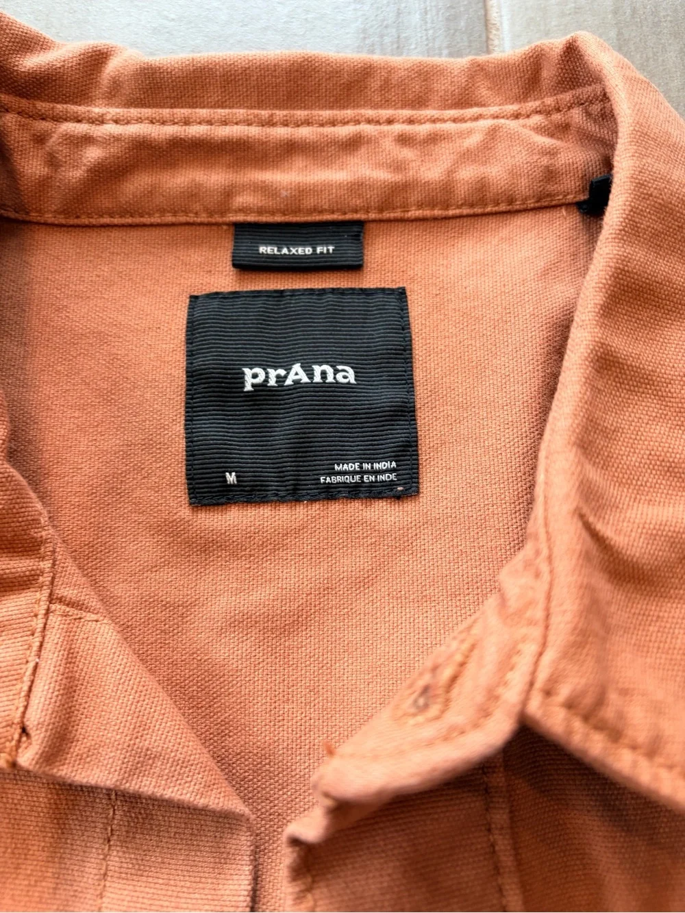 Prana button front